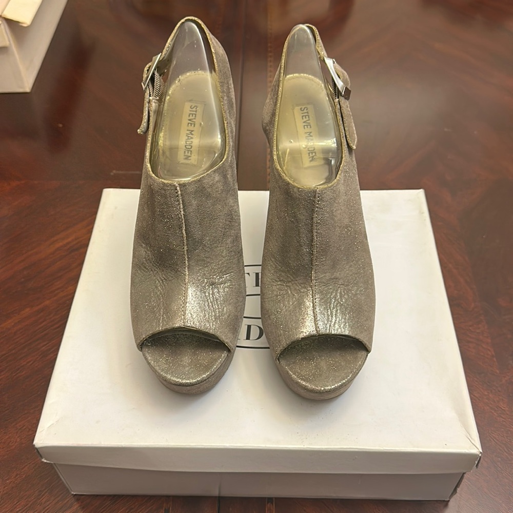Silver heels, never worn .